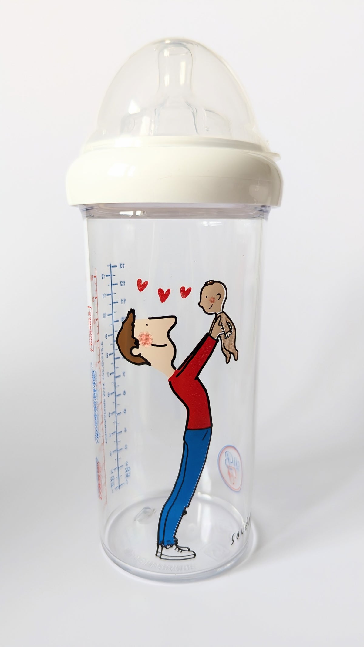 Biberon de 360 ml avec une image du bébé tenu dans les bras pas son papa avec des coeurs rouges entre eux